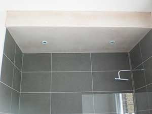 Newly fitted & tiled bathroom required a ceiling plastered above the bath in Clapham SW11