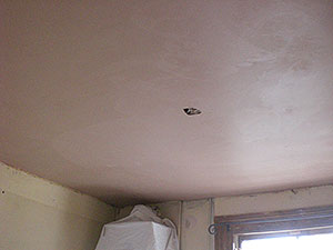 Newly plasterered ceiling over textured surface in Wimbledon SW19