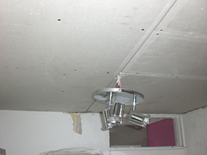 The London Plasterer in Fulham SW6. Replacement ceiling has been boarded with plasterboard ready for skimming.